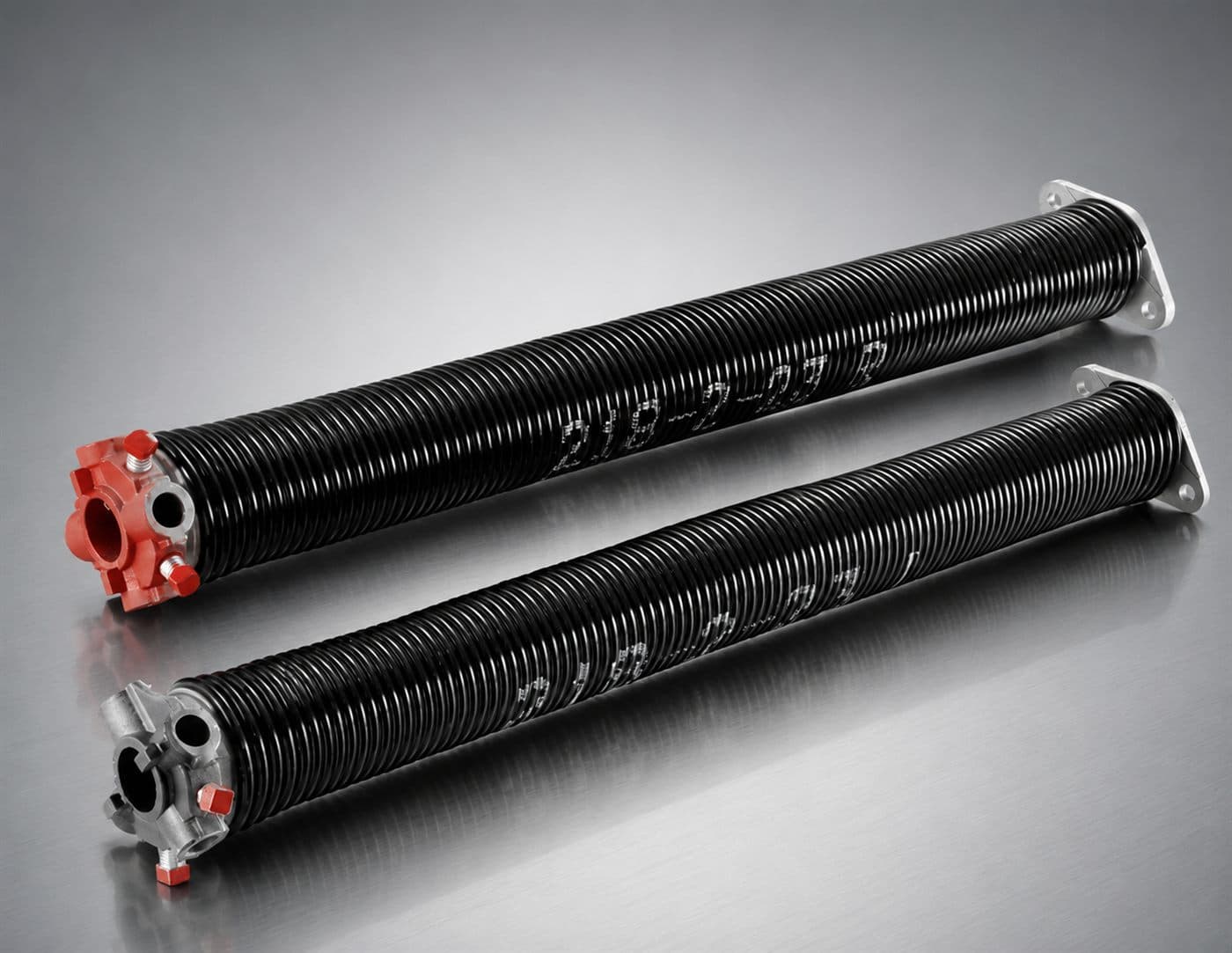 Torsion spring system above a garage door